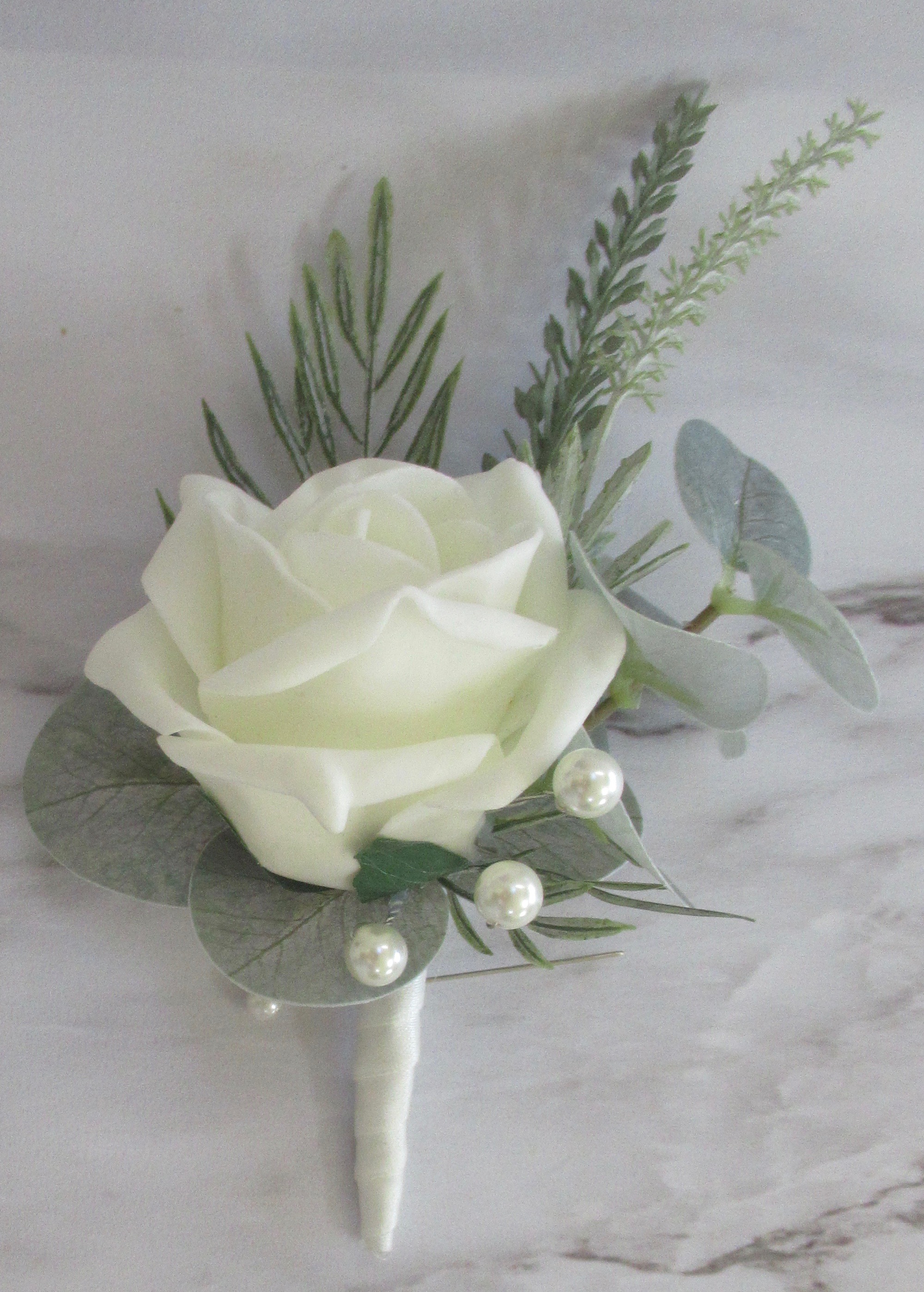 sage green lifelike buttonhole